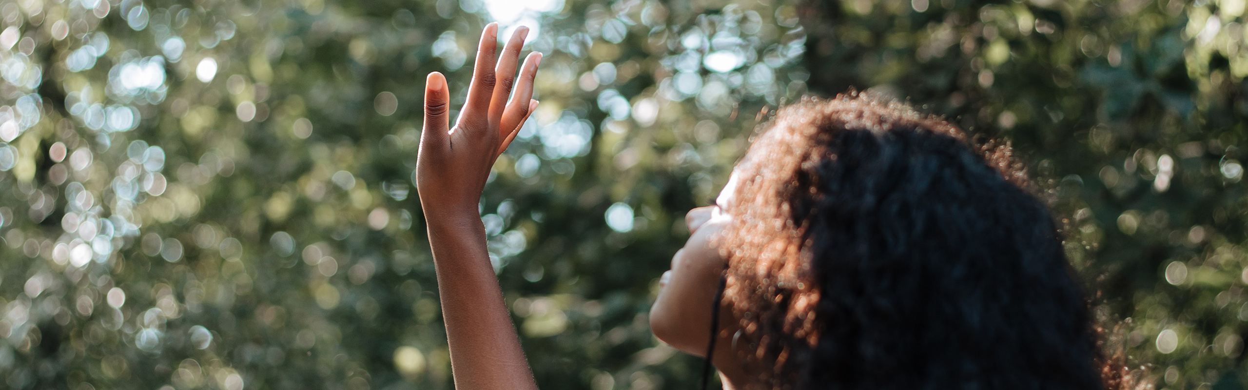 Girl holding her hand up to the light