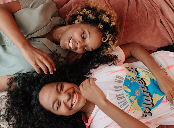 Adult and young person smiling